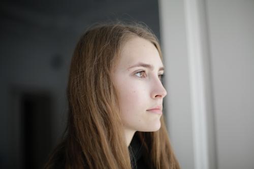 Woman looking out window